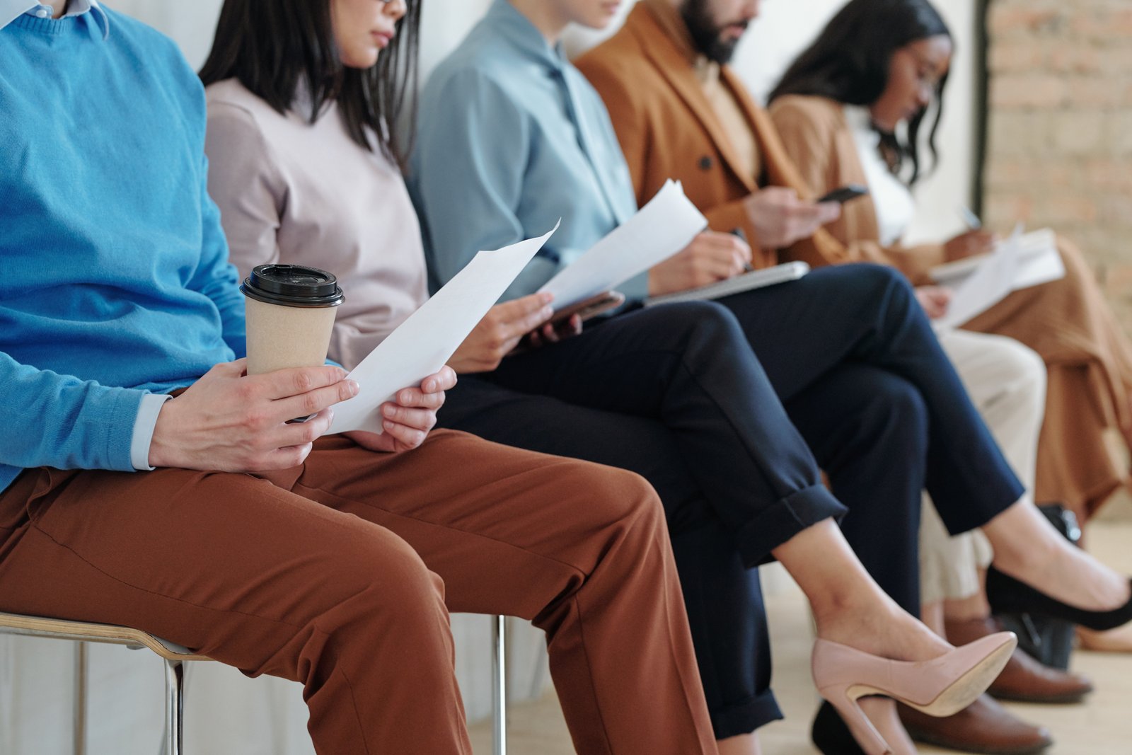 Professionals awaiting interviews in a corporate setting